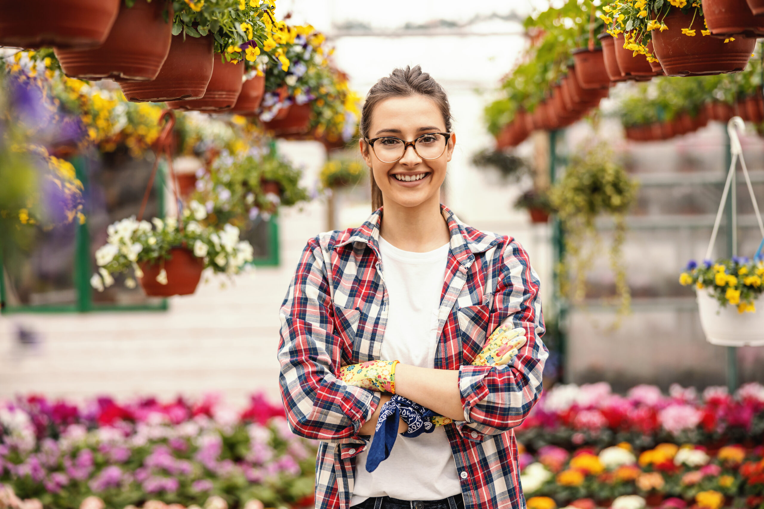 Young,Successful,Smiling,Small,Business,Owner,Standing,In,Hothouse,Full